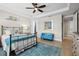Inviting main bedroom with tray ceiling, light-colored walls, and bright natural light at 13873 Karina St, Venice, FL 34293