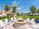Outdoor fire pit with comfortable seating, perfect for gathering with friends and Gathering in a beautiful setting at 13873 Karina St, Venice, FL 34293