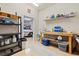 Spacious garage featuring ample storage shelves, workbench, and a glimpse of the parked car beyond the doorway at 13873 Karina St, Venice, FL 34293