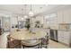 Bright, spacious kitchen with stainless steel appliances and granite countertops for a luxurious cooking space at 13873 Karina St, Venice, FL 34293