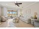 Spacious living room with bright neutral colors and patio access at 13873 Karina St, Venice, FL 34293
