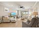 Cozy living room is bright with a sliding door and several windows at 13873 Karina St, Venice, FL 34293
