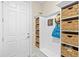 Well-organized mudroom with built-in storage, hooks, bench, and cubbies for an efficient entry area at 13873 Karina St, Venice, FL 34293
