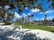 Fun playground area with climbing structures, artificial turf, and a safe, fenced environment for children at 13873 Karina St, Venice, FL 34293