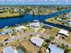 Stunning aerial view of waterfront homes along a scenic canal community at 140 Poinsettia Ne Cir, Port Charlotte, FL 33952
