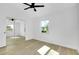Bedroom with large, mirrored closet and ample light at 140 Poinsettia Ne Cir, Port Charlotte, FL 33952