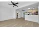 Open floor plan with sleek floors, recessed lights, and modern ceiling fans at 140 Poinsettia Ne Cir, Port Charlotte, FL 33952