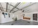 This garage has painted walls, a painted floor, storage cabinets, and a workbench at 143 Braemar Ave, Venice, FL 34293