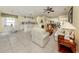Open floor plan with living room and kitchen, creating a seamless flow for entertaining at 143 Braemar Ave, Venice, FL 34293