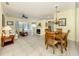 Spacious living room featuring a fireplace, tile floors and an open floor plan at 143 Braemar Ave, Venice, FL 34293