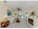 Inviting living room with comfortable seating and natural light, steps from outdoor patio at 143 Braemar Ave, Venice, FL 34293