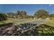 Outdoor view of the meticulously maintained shuffleboard courts on a sunny day at 143 Braemar Ave, Venice, FL 34293