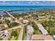 Beautiful aerial view of coastal neighborhood featuring waterfront homes and vibrant blue ocean at 1730 Manasota Beach Rd # 215, Englewood, FL 34223