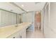 Bathroom with vanity, closet, and toilet with shower at 1730 Manasota Beach Rd # 215, Englewood, FL 34223