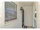 Welcoming condo entrance featuring a window, door, and stylish light fixture at 1730 Manasota Beach Rd # 215, Englewood, FL 34223