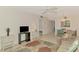 Bright living area with comfortable seating, dining space, and modern furnishings on tile floor at 1730 Manasota Beach Rd # 215, Englewood, FL 34223