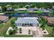 Home featuring a spacious driveway and waterfront access at 18302 Burkholder Cir, Port Charlotte, FL 33948