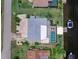 Aerial view of the property featuring a boat dock and screened in pool at 18302 Burkholder Cir, Port Charlotte, FL 33948