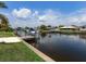 A serene canal-front property with private dock, offering easy access to the water and surrounding waterways at 18302 Burkholder Cir, Port Charlotte, FL 33948