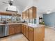 This kitchen has bright cabinets and stainless steel appliances and offers bright backyard views at 18302 Burkholder Cir, Port Charlotte, FL 33948