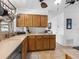 This kitchen features stone tile countertops, stainless steel appliances, and bright natural lighting at 18302 Burkholder Cir, Port Charlotte, FL 33948