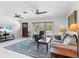 Comfortable living room area with ample natural light, neutral tones, and an inviting atmosphere at 18302 Burkholder Cir, Port Charlotte, FL 33948