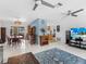 Open-concept living area seamlessly connecting to dining and kitchen spaces with lots of natural light at 18302 Burkholder Cir, Port Charlotte, FL 33948