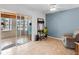 Bright office space features sliding glass doors to screened lanai and a work from home setup at 18302 Burkholder Cir, Port Charlotte, FL 33948