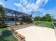 A spacious screened patio seamlessly connects to a private dock, offering access to waterfront living at 18302 Burkholder Cir, Port Charlotte, FL 33948