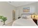 Bedroom showcasing a comfortable bed, natural light from the window, and stylish interior decor at 20636 Swallowtail Ct, Venice, FL 34293