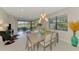 Open concept dining area flowing into the living room with water views at 20636 Swallowtail Ct, Venice, FL 34293