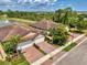 Beautiful residential neighborhood with sidewalks, paver driveways, immaculate lawns, and serene lake views at 20636 Swallowtail Ct, Venice, FL 34293