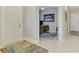 Bright foyer with tile flooring, an entryway, an office, and a front door at 20636 Swallowtail Ct, Venice, FL 34293