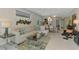 Spacious open-concept living and dining area with stylish decor and water views at 20636 Swallowtail Ct, Venice, FL 34293