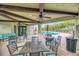 Outdoor lounge featuring comfortable seating, ceiling fans, and pool views at 20636 Swallowtail Ct, Venice, FL 34293