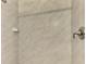 Close-up of the tiled shower with brushed metal fixtures at 20636 Swallowtail Ct, Venice, FL 34293