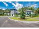 Beautiful clubhouse with stone accents, blue trim, and lush landscaping at 21057 Anclote Ct, Venice, FL 34293
