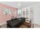 Stylish home office with a large desk, built-in shelving, and comfortable seating at 21057 Anclote Ct, Venice, FL 34293