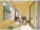 Cozy balcony with patio seating, perfect for enjoying outdoor relaxation and sunny views at 212 Triano Cir # 212, Venice, FL 34292