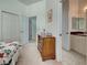 Comfortable bedroom with closet, adjoining bathroom and bedroom, and soft neutral carpet at 212 Triano Cir # 212, Venice, FL 34292
