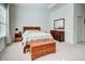 Comfortable bedroom with natural light, featuring a dresser, chest, and cozy decor at 212 Triano Cir # 212, Venice, FL 34292