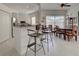Bright dining area featuring a breakfast bar and an elegant dining table at 212 Triano Cir # 212, Venice, FL 34292