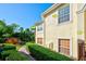 Well-maintained exterior with lush landscaping, beautiful stone features and bright windows at 212 Triano Cir # 212, Venice, FL 34292