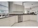 Kitchen with stainless steel appliances, granite countertops and white cabinetry at 212 Triano Cir # 212, Venice, FL 34292