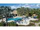Resort-style pool with palm trees, waterfall feature, and plenty of lounge chairs at 212 Triano Cir # 212, Venice, FL 34292