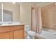 Bright bathroom featuring tile floors, and a tub shower combination at 2150 Snapdragon Ln, Venice, FL 34292