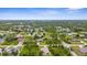 A neighborhood aerial view showing homes with mature trees, creating a tranquil and inviting setting at 2267 Yalta Ter, North Port, FL 34286