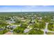 A peaceful residential neighborhood with a view of green trees and homes in a friendly community at 2267 Yalta Ter, North Port, FL 34286