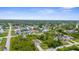 A picturesque aerial perspective of the neighborhood featuring well-spaced homes amid mature trees, creating a serene, residential atmosphere at 2267 Yalta Ter, North Port, FL 34286