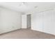 Bedroom with a ceiling fan, carpet flooring, a closet and an open door to the hallway at 2267 Yalta Ter, North Port, FL 34286